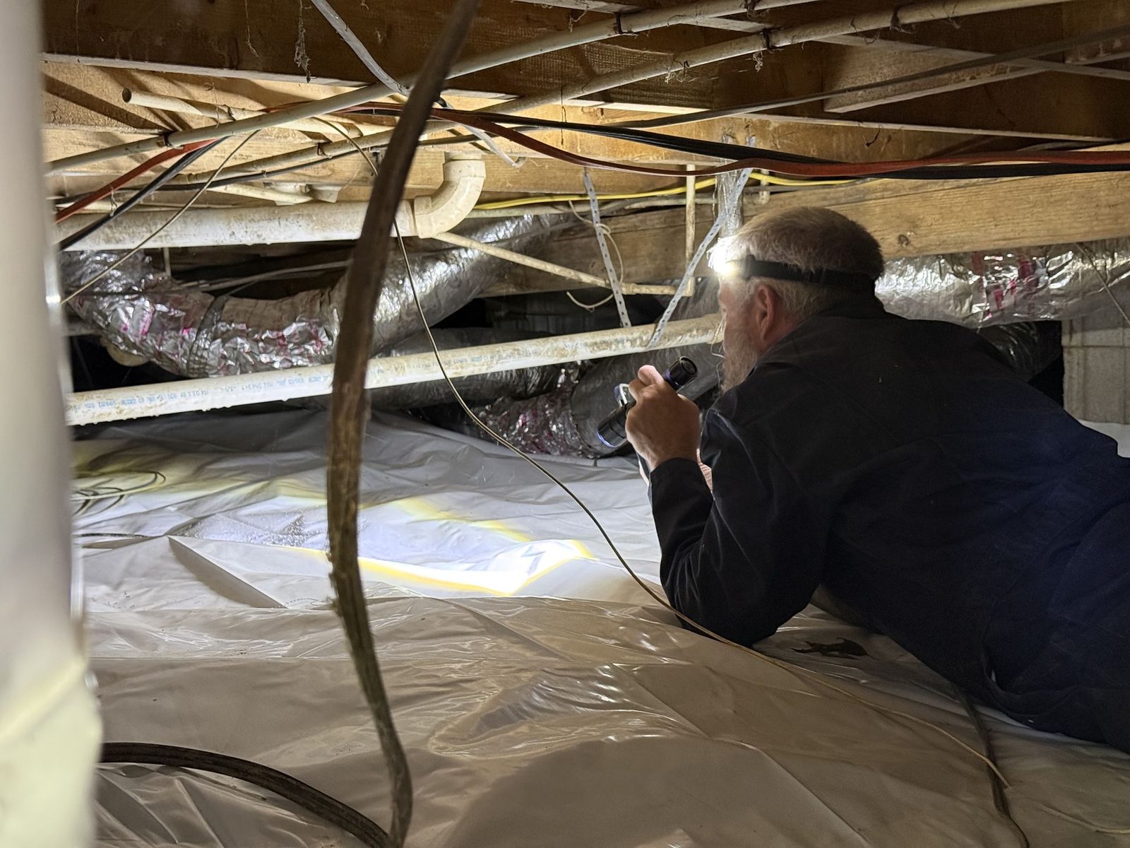 Jon Harris evaluating the condition of a home during an inspection